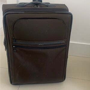 Tumi brown carry on luggage